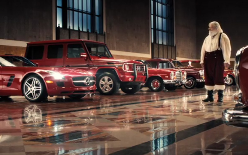 A red Mercedes-Benz C 250 Sport Sedan in Santa's garage