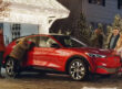 The Griswolds looking at a red Ford Mach-E