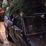 1990 Jeep Cherokee with Christmas tree on top