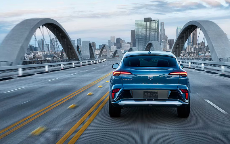 The back of a blue 2026 Buick Envista crossing a bride