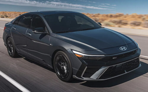A dark gray 2026 Hyundai Elantra driving down the highway.