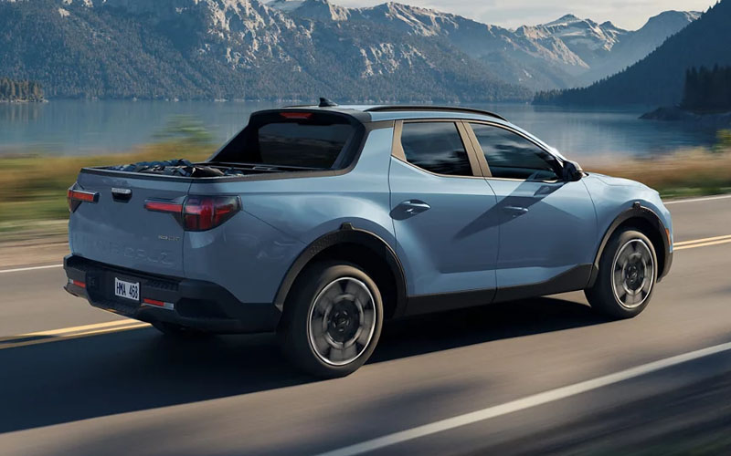 Blue 2026 Hyundai Santa Cruz Driving