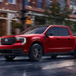 Red 2026 Ford Maverick driving on the road