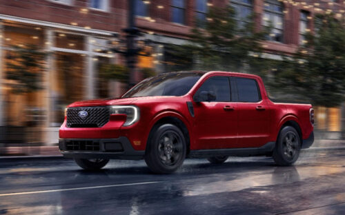 Red 2026 Ford Maverick driving on the road