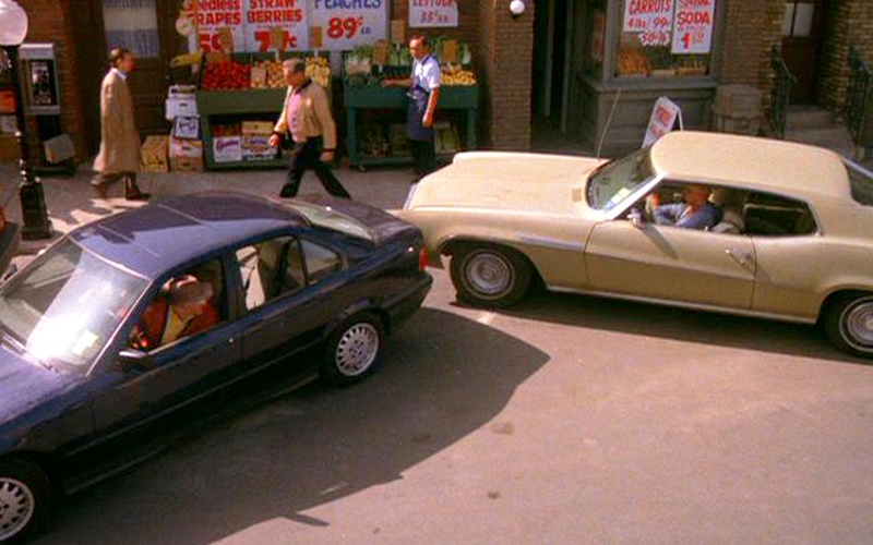 Cars of Seinfeld BMW 325i A dark-colored 1992 BMW 325i and a yellow 1969 Buick LeSabre trying to parallel park on the show Seinfeld.