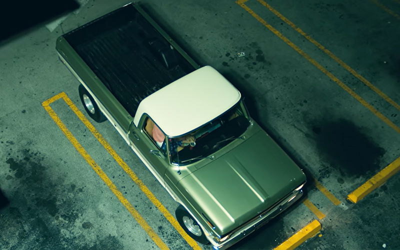 Ford F-100 Bad Bunny Moscow Mule A green and white fifth-generation Ford F-100 in a parking lot