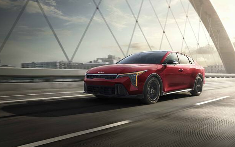 Red 2026 Kia K4 Driving