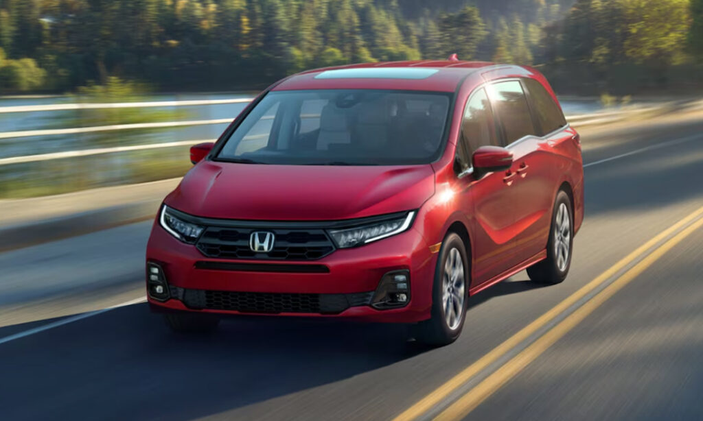 Red 2026 Honda Odyssey Driving