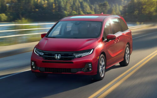 Red 2026 Honda Odyssey Driving
