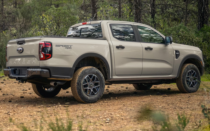 2026 Ford Ranger A brown-gray 2026 Ford Ranger parked in the woods.
