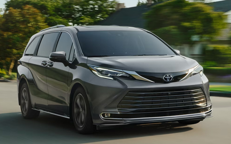 A gray 2026 Toyota Sienna in motion on a city street