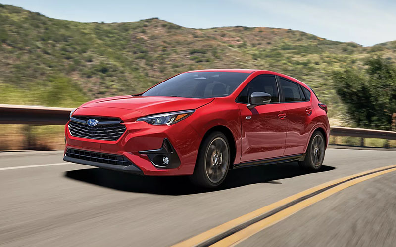 Red 2026 Subaru Impreza Driving