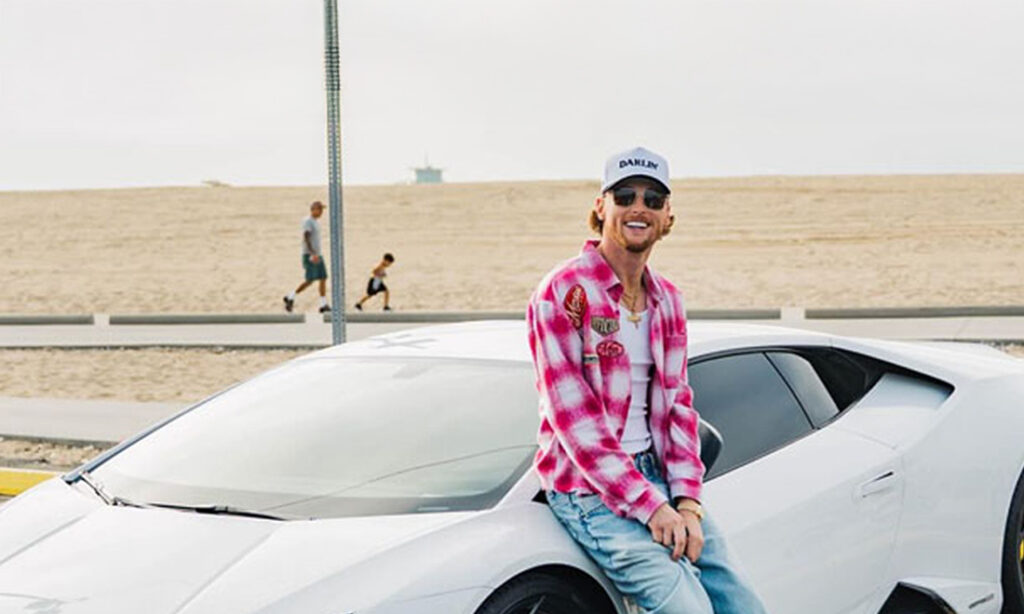 Bailey ZImmerman with his white Lamborghini Huracan Evo
