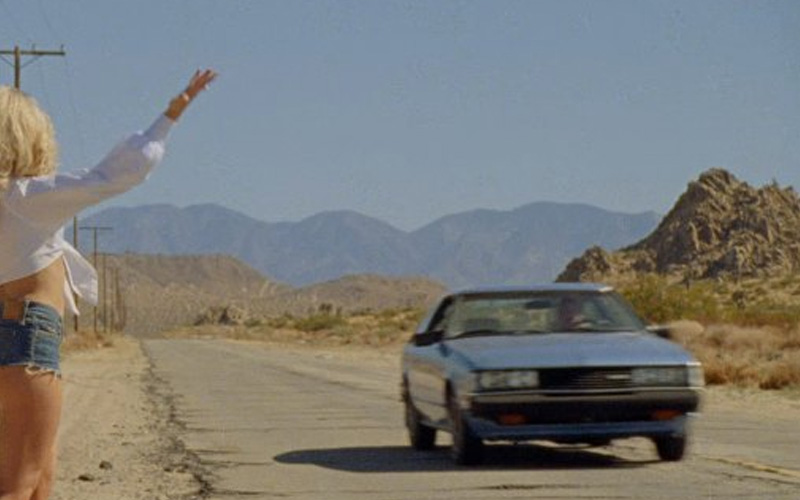 SC_Toyota_Celica Sabrina Carpenter waving down a blue 1980 Toyota Celica