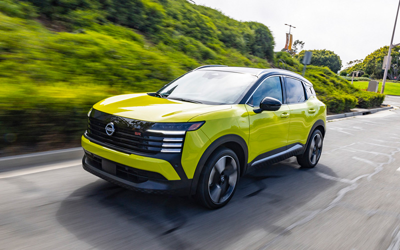 2026 Nissan Kicks driving down the road