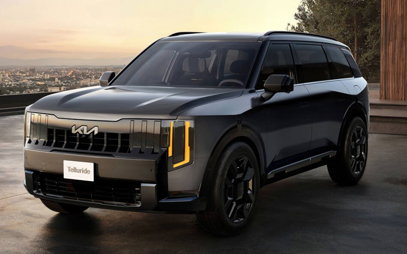 2027 Kia Telluride header A gray 2027 Kia Telluride parked in front of a skyline of a city