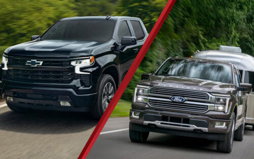 2026 Ford F-150 and 2026 Chevrolet Silverado 1500 driving down the road